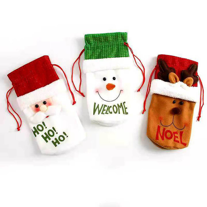Three Christmas-themed goodies bags with Santa, snowman, and reindeer designs