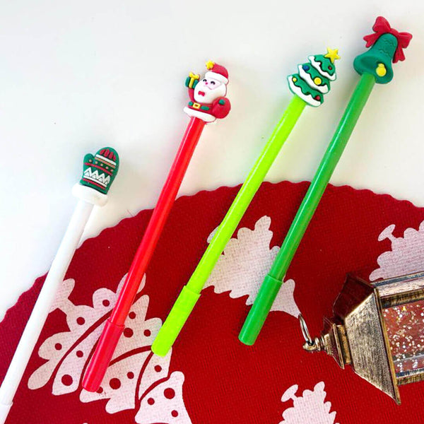 Four colorful pens with Christmas-themed tips