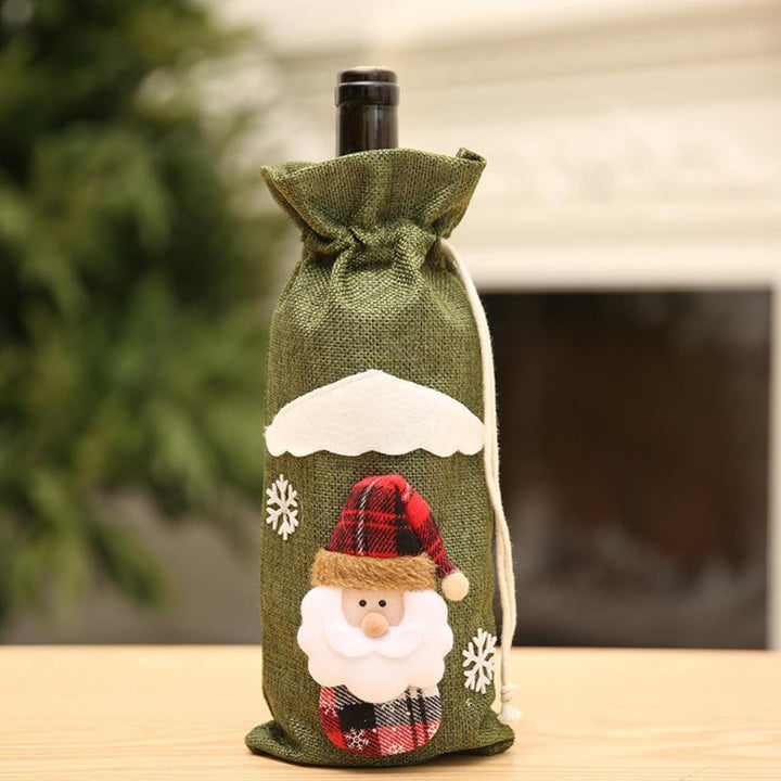 Bottle wrapped in a Santa linen green bag