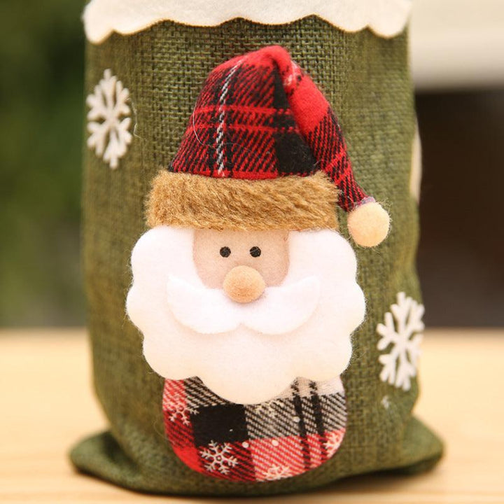 Close-up of linen holiday bottle cover with a santa design