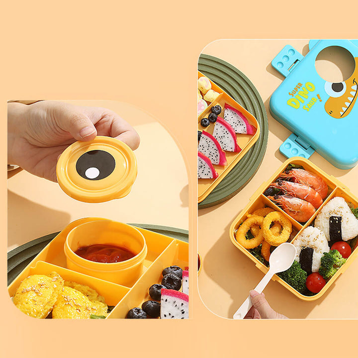Children's bento box with a cute dino design with compartments filled with food 