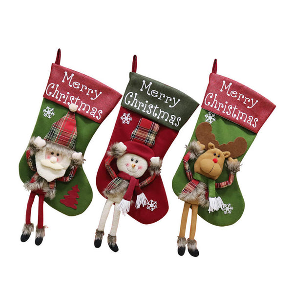 Three Christmas stockings with Santa, snowman, and reindeer with dangling legs