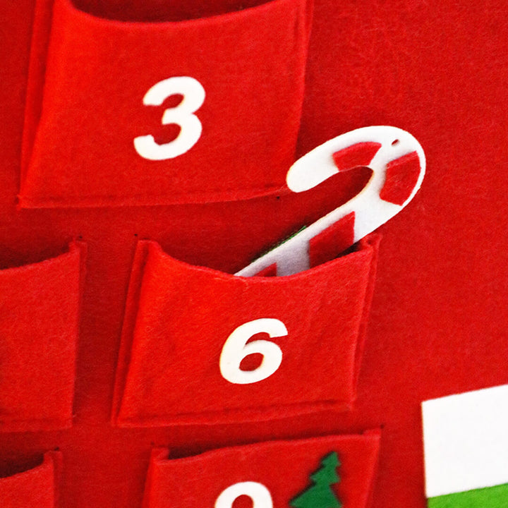 Red advent calendar with white numbers to fill in treats for Christmas suprises