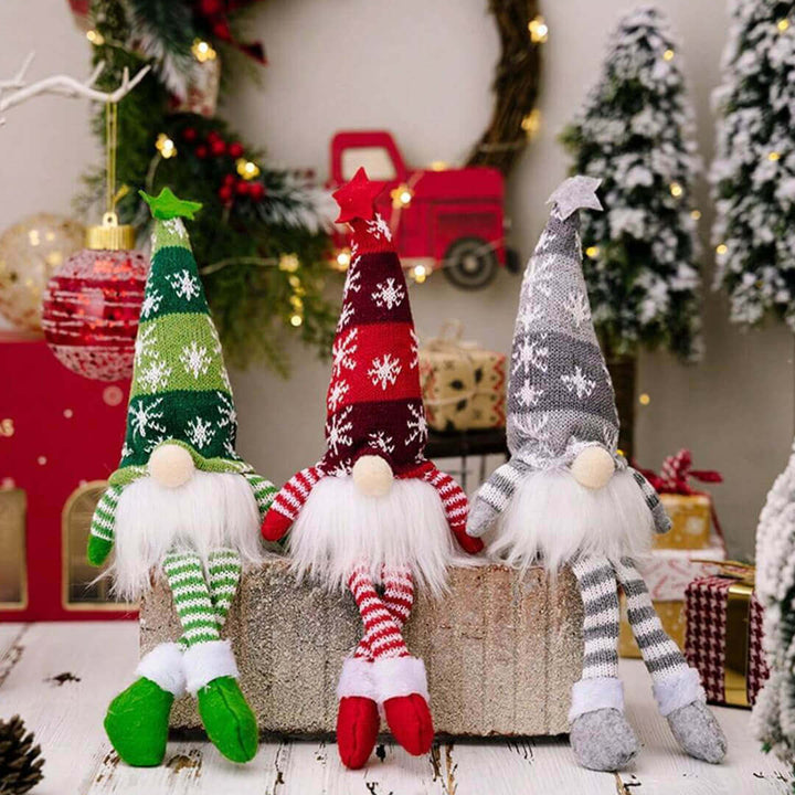 Light-up Christmas gnome sitting on a shelf with long dangling legs