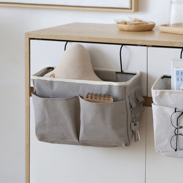 Grey hanging bedside storage organizer with hooks