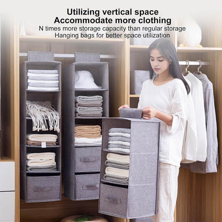 Closet storage unit hanging from rod with clothes