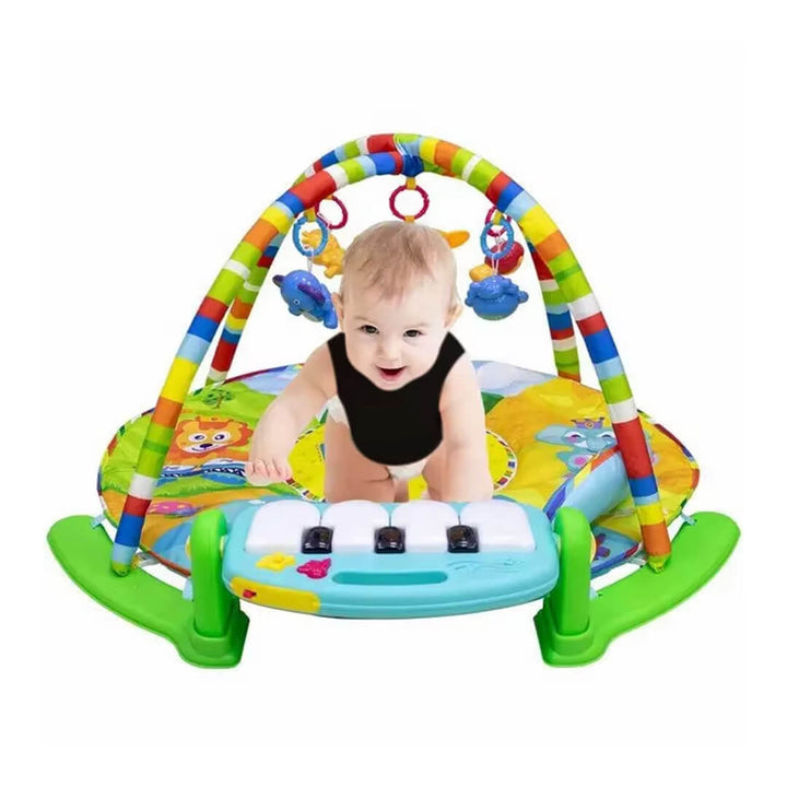 Infant kicking a musical piano keyboard on a 4-in-1 baby gym