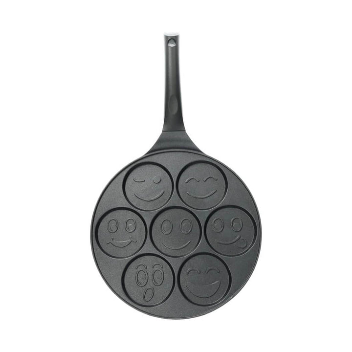 27cm griddle cooking seven smiley pancakes, top angle