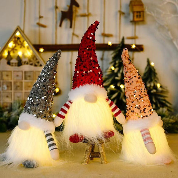 Glitter gnome Christmas decoration glowing with sparkly fabric