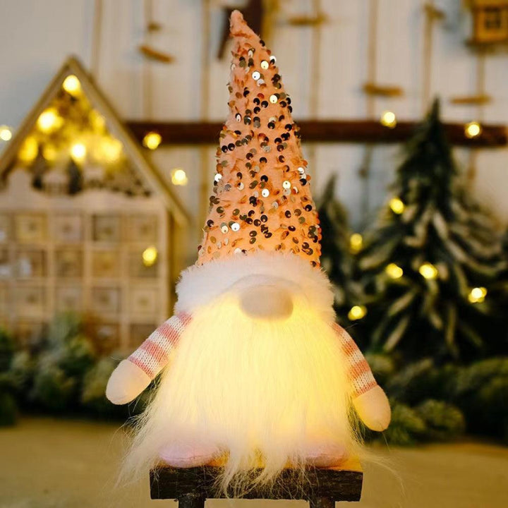 Sparkling pink Christmas gnome with soft LED light
