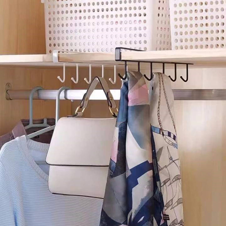Cabinet-mounted hanger for ties, scarves, amd belts