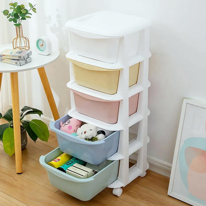 Multicolored 5-layer plastic drawer cabinet with wheels, light colors with goods inside.