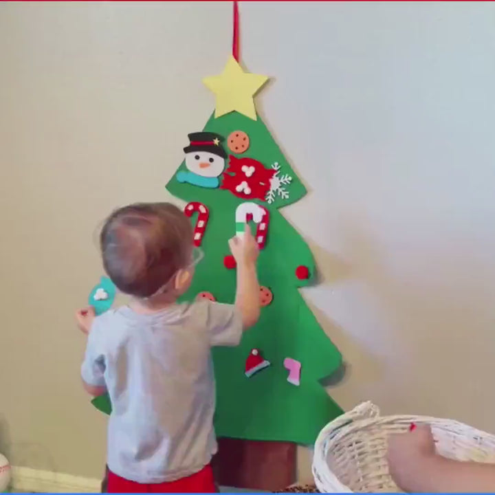 Video of Kids decorating a soft felt Christmas tree with Velcro ornaments
