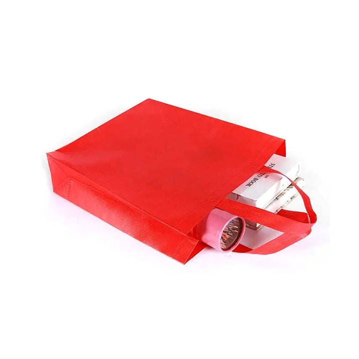 Portrait red reusable shopping bags with items inside