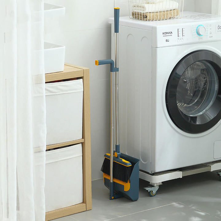 Petrol broom set stored upright with snap-in handle and compact design