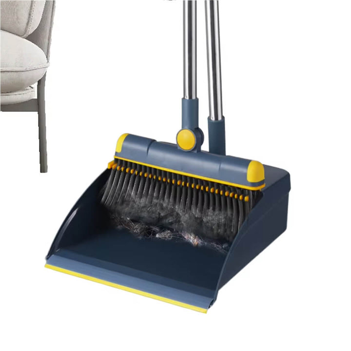 Blue and yellow broom and dustpan with collected dust