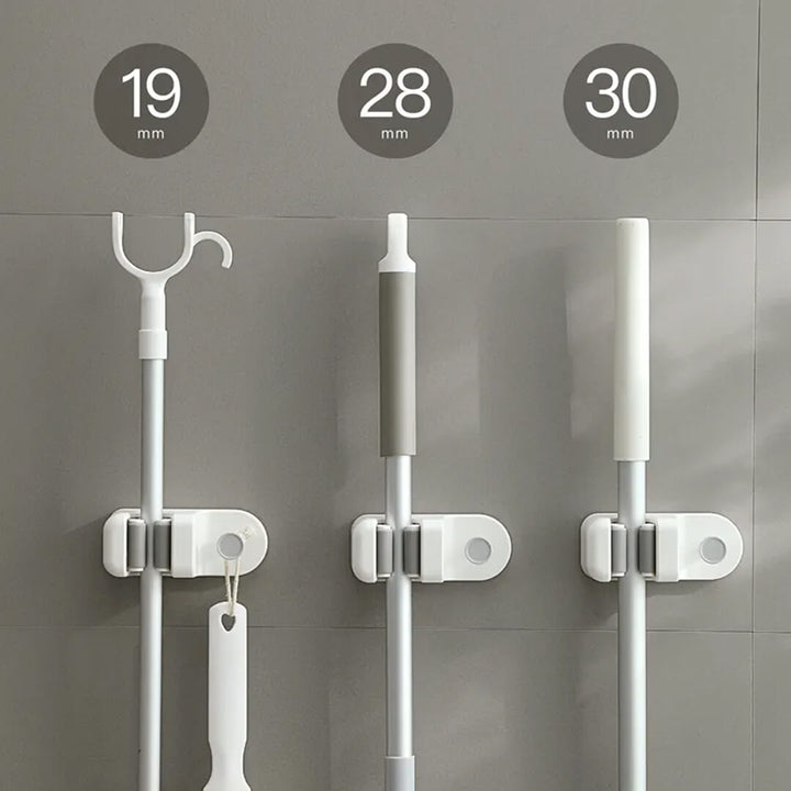 Compact mop holder with integrated towel hook
