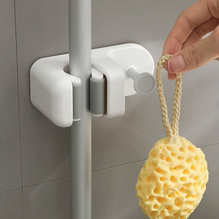 Cleaning supply organizer with mop clamp and hook