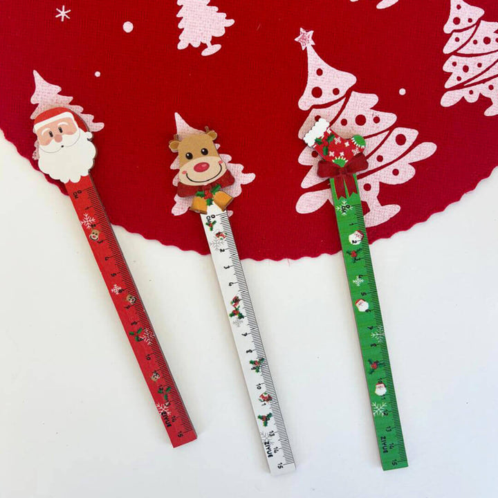 Christmas-themed rulers with Santa, reindeer, and tree designs for party favors