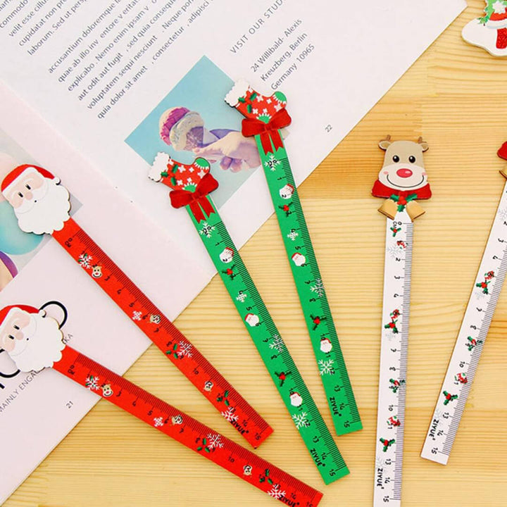 Set of Christmas-themed rulers with Santa Claus, reindeer, and stocking designs.
