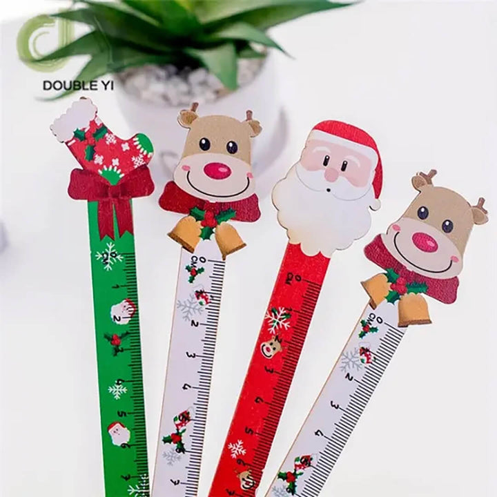 Four Christmas-themed rulers with Santa Claus, reindeer, and gift designs