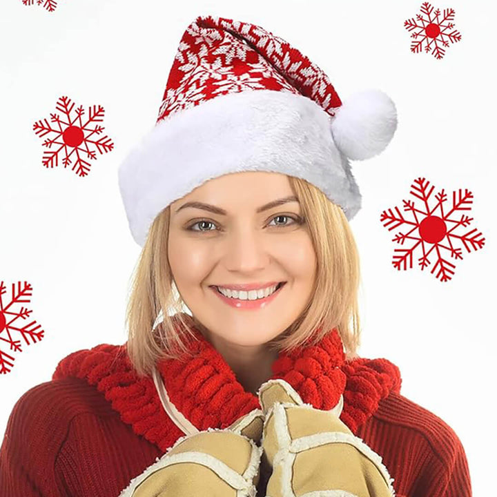 Red knitted wool Christmas hat with white snowflake pattern